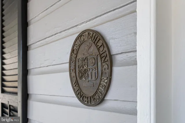 a view of a balcony with couch and chairs
