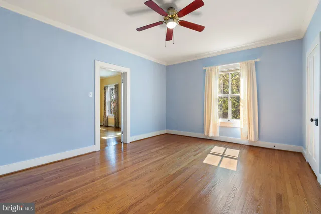 a view of a house with wooden fence