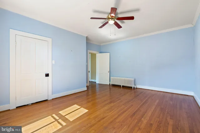 a view of a patio with table and chairs and potted plants with wooden floor and fence
