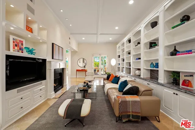 a living room with fireplace furniture and a flat screen tv