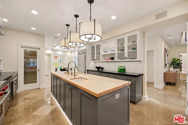 a kitchen with a stove and a table