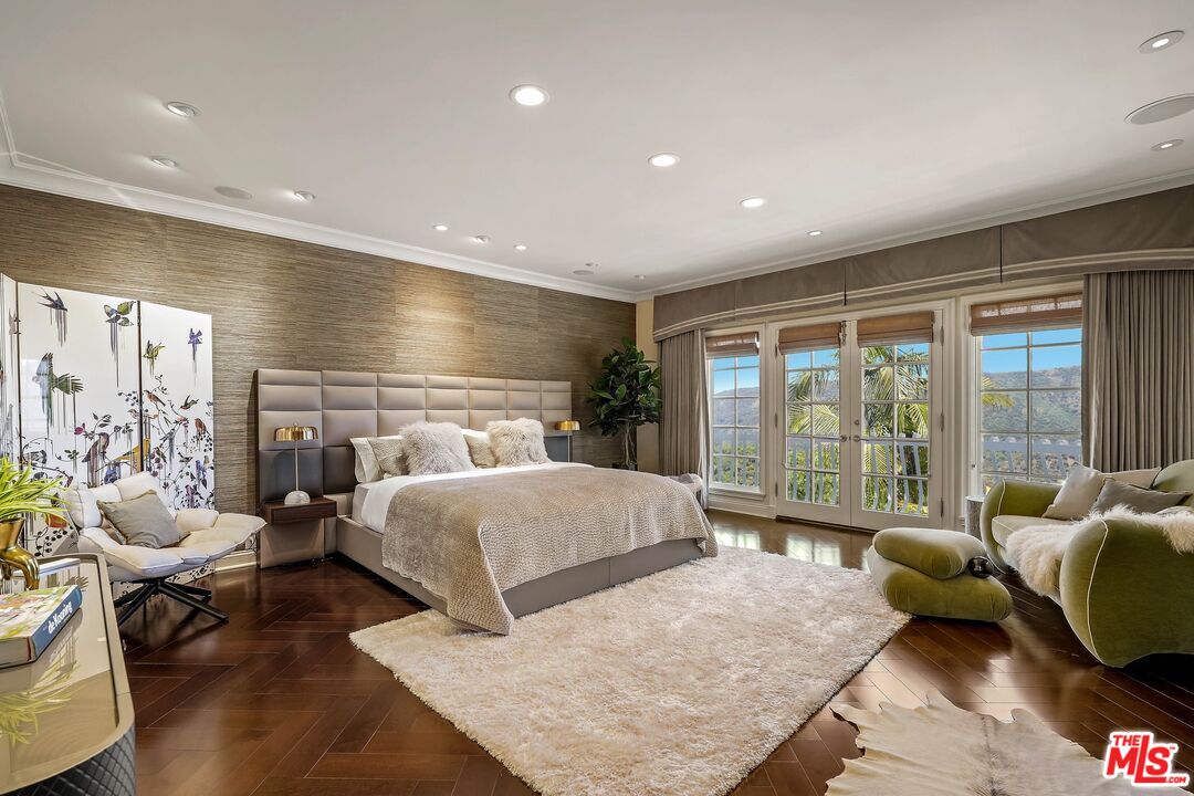 2305 Canyonback Road Los Angeles, CA 90049 - Photo 19 of 50 a living room with furniture and a large window