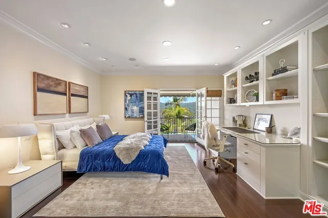 a spacious bedroom with a large bed and a couch