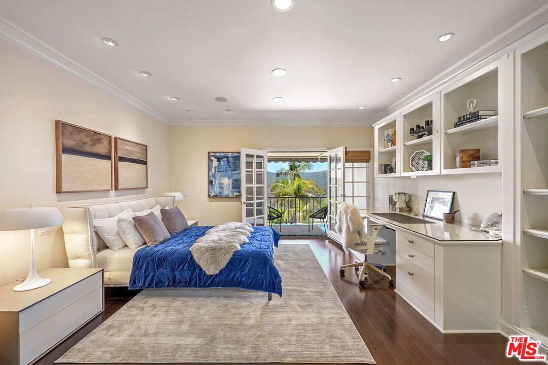 2305 Canyonback Road Los Angeles, CA 90049 - Photo 26 of 50 a spacious bedroom with a large bed and a couch