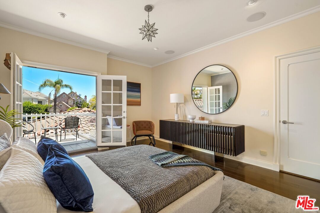 2305 Canyonback Road Los Angeles, CA 90049 - Photo 29 of 50 a living room with furniture a rug and a flat screen tv