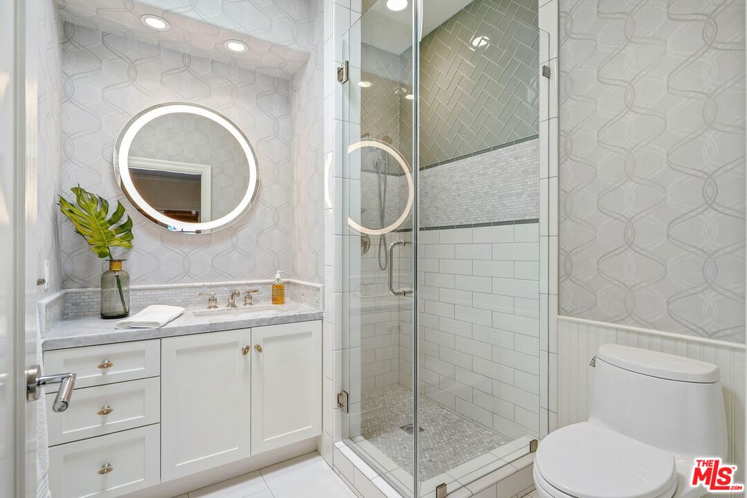 2305 Canyonback Road Los Angeles, CA 90049 - Photo 34 of 50 a bathroom with a toilet a sink and shower