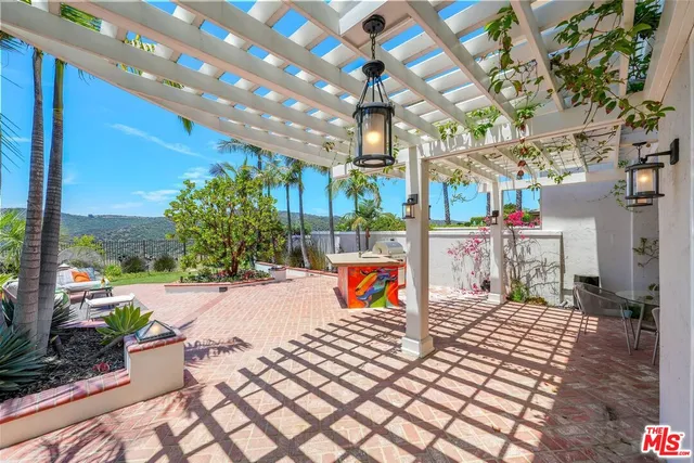 a view of a chairs and tables in patio