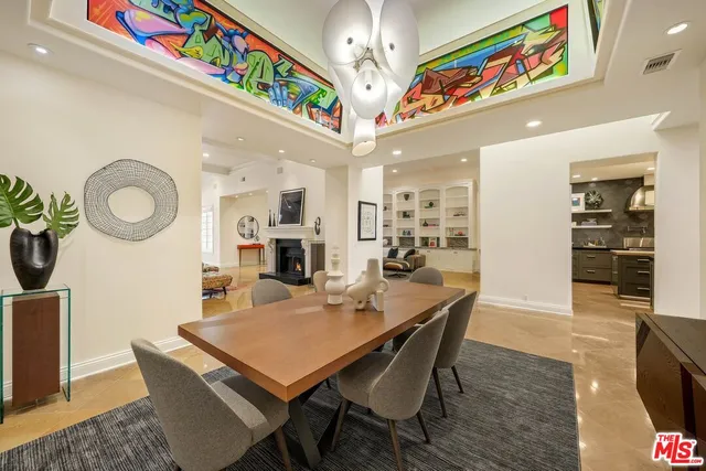a view of a dining area with furniture and a chandelier