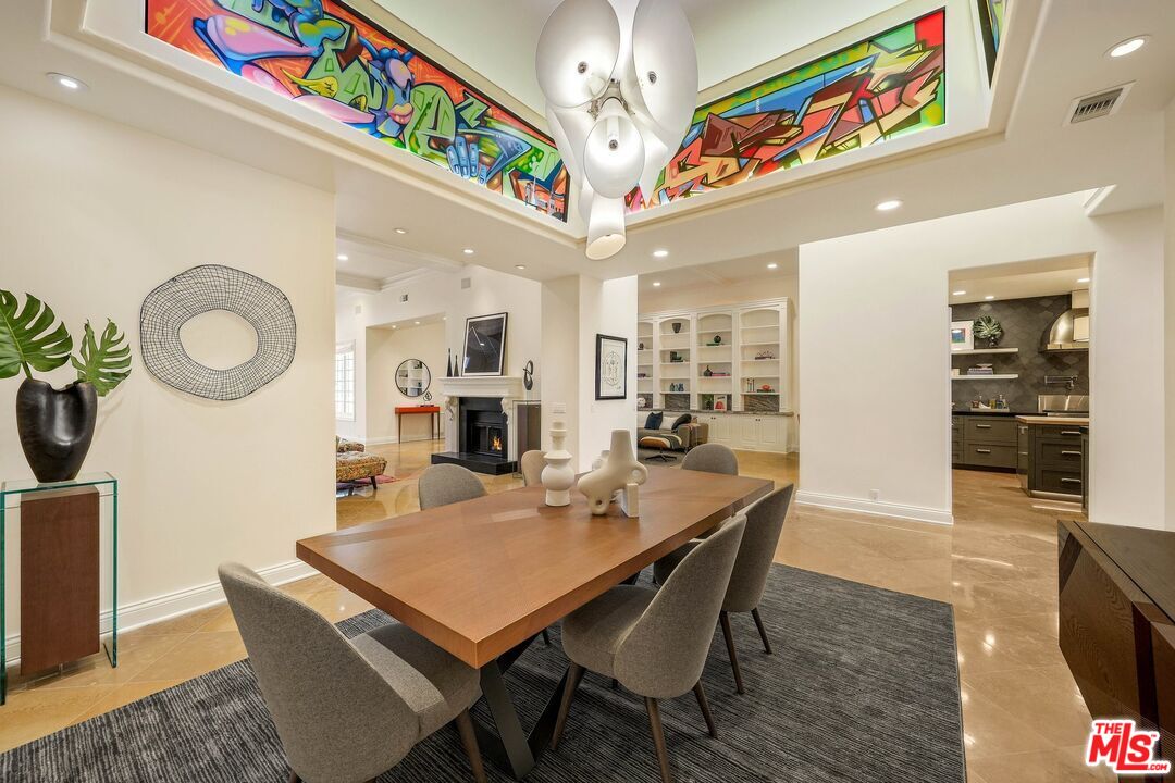 2305 Canyonback Road Los Angeles, CA 90049 - Photo 5 of 50 a view of a dining area with furniture and a chandelier