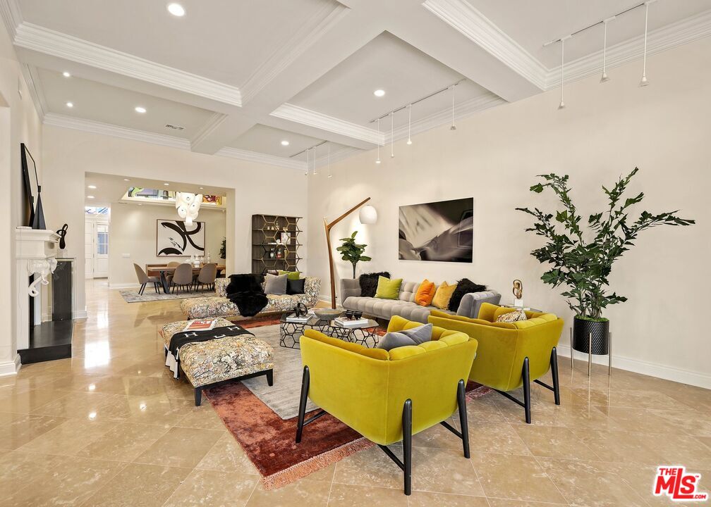 2305 Canyonback Road Los Angeles, CA 90049 - Photo 6 of 50 a living room with furniture fireplace and a flat screen tv