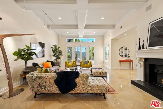 a living room with furniture fireplace and flat screen tv