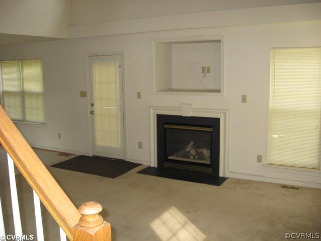 1416 Tree Ridge Road Richmond, VA 23231 - Photo 2 of 5 a living room with a fireplace