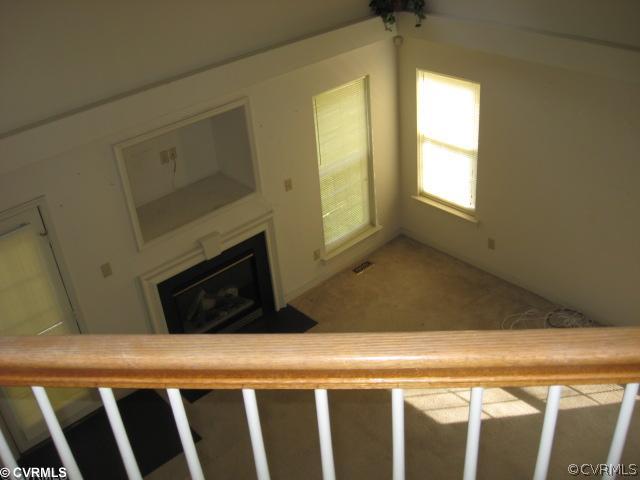 1416 Tree Ridge Road Richmond, VA 23231 - Photo 4 of 5 a view of a livingroom with wooden floor and a fireplace
