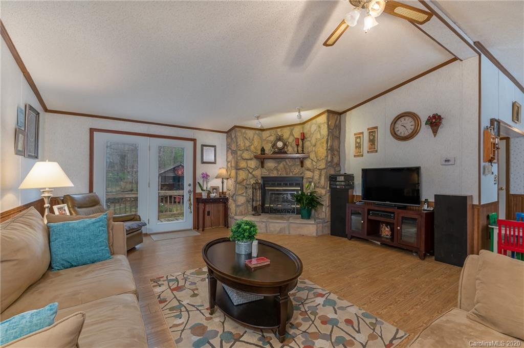 526 Parris Road Rutherfordton, NC 28139 - Photo 13 of 27 a living room with furniture and a flat screen tv