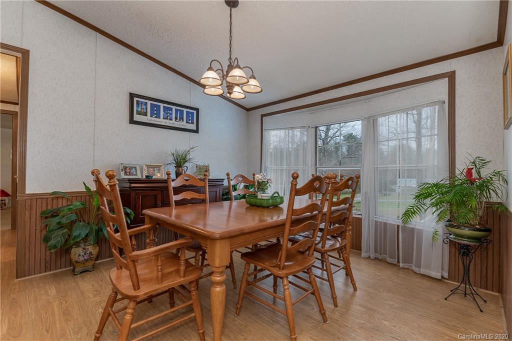 526 Parris Road Rutherfordton, NC 28139 - Photo 21 of 27 a view of a dining room with furniture window and wooden floor