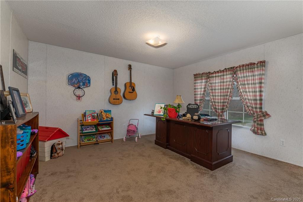 526 Parris Road Rutherfordton, NC 28139 - Photo 26 of 27 a room with furniture and a window