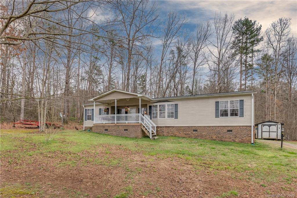526 Parris Road Rutherfordton, NC 28139 - Photo 4 of 27 a front view of a house with garden