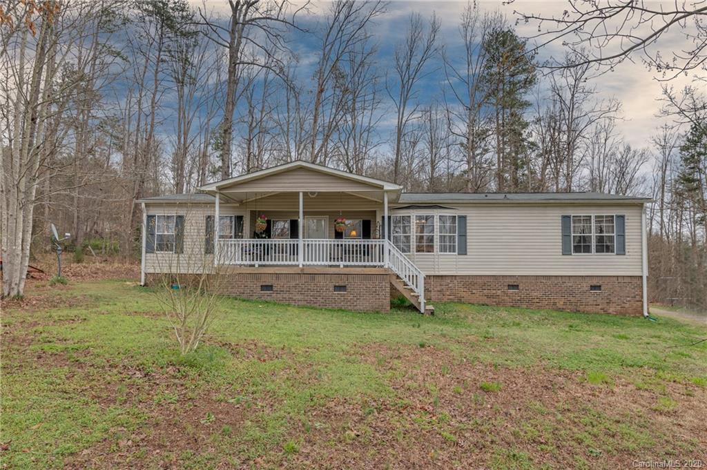 526 Parris Road Rutherfordton, NC 28139 - Photo 5 of 27 a front view of a house with a garden