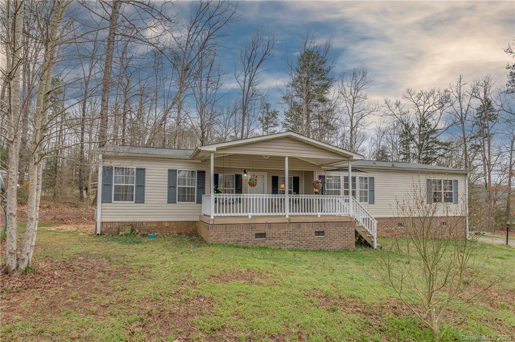 526 Parris Road Rutherfordton, NC 28139 - Photo 6 of 27 a front view of a house with a yard