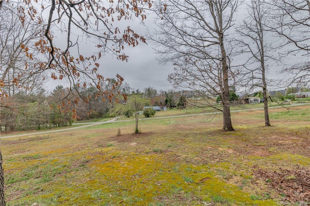 526 Parris Road Rutherfordton, NC 28139 - Photo 7 of 27 a view of a field with trees in the background