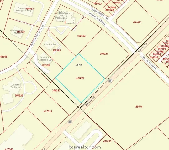 workspace with white cabinets and wooden floor