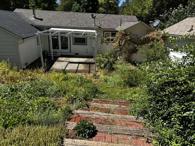 a backyard of a house with lots of green space