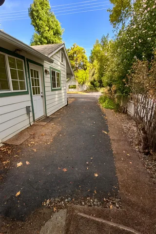 a view of a house with a tree