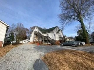a view of a house with a snow in front of it