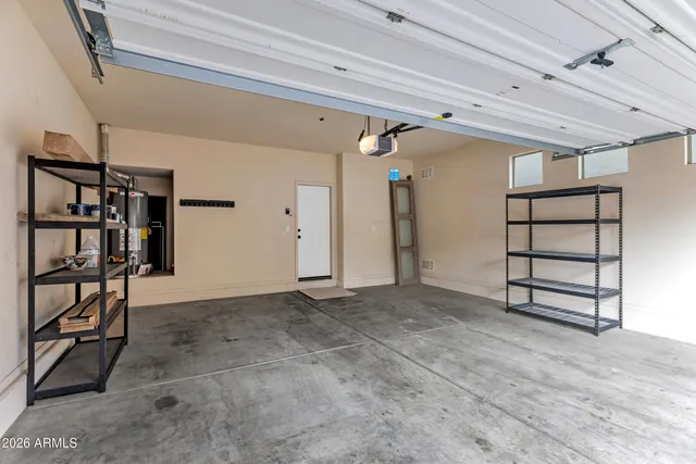 a view of a house with a yard and garage