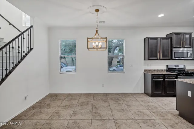 a view of a kitchen with an oven a sink and dishwasher