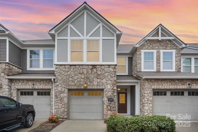 a front view of a house with a garage