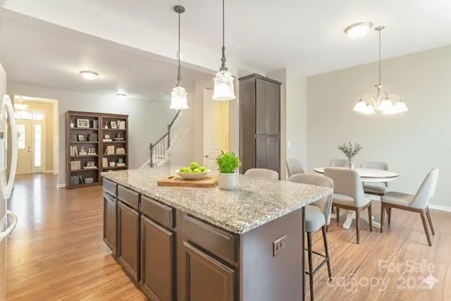 a kitchen with a table and chairs in it