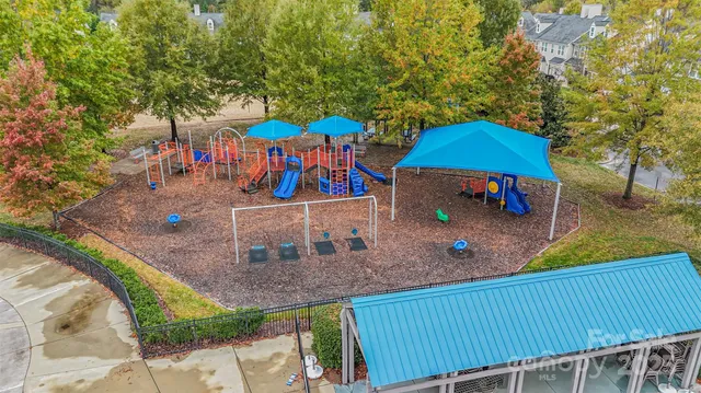 an aerial view of a chairs and table on the patio