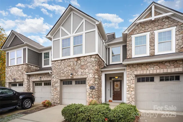 a view of a big house with many windows