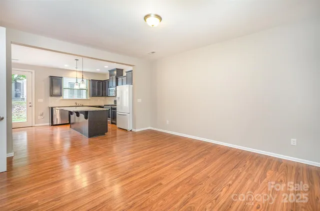 a view of kitchen with wooden floor and window