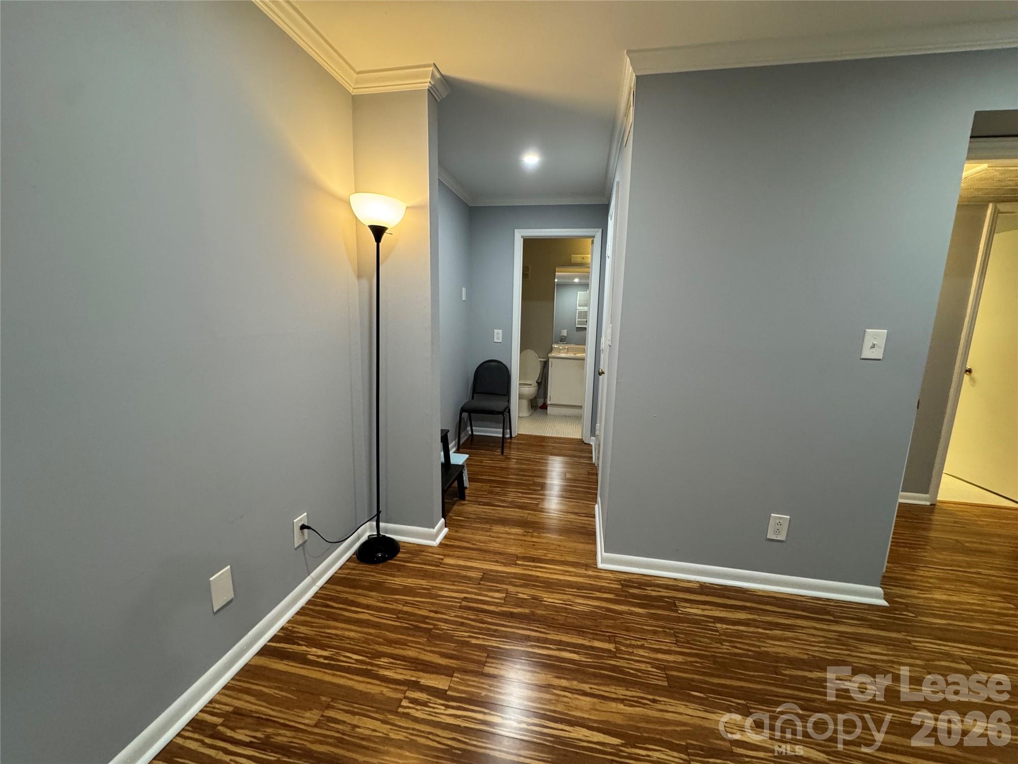 1323 Queens Road, Unit 303 Charlotte, NC 28207 - Photo 16 of 47 a view of a room with wooden floor