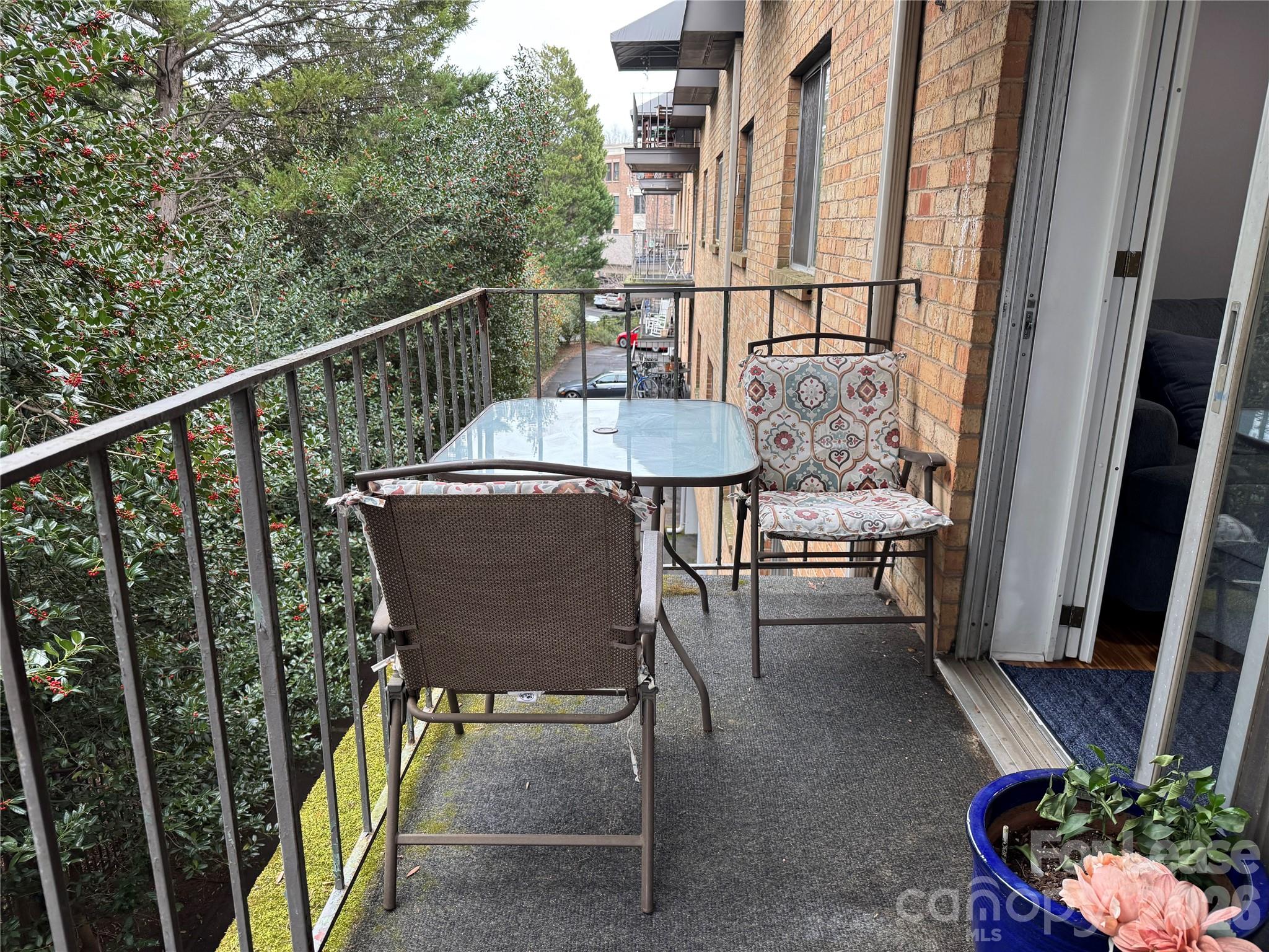 1323 Queens Road, Unit 303 Charlotte, NC 28207 - Photo 21 of 47 a view of a balcony with chairs