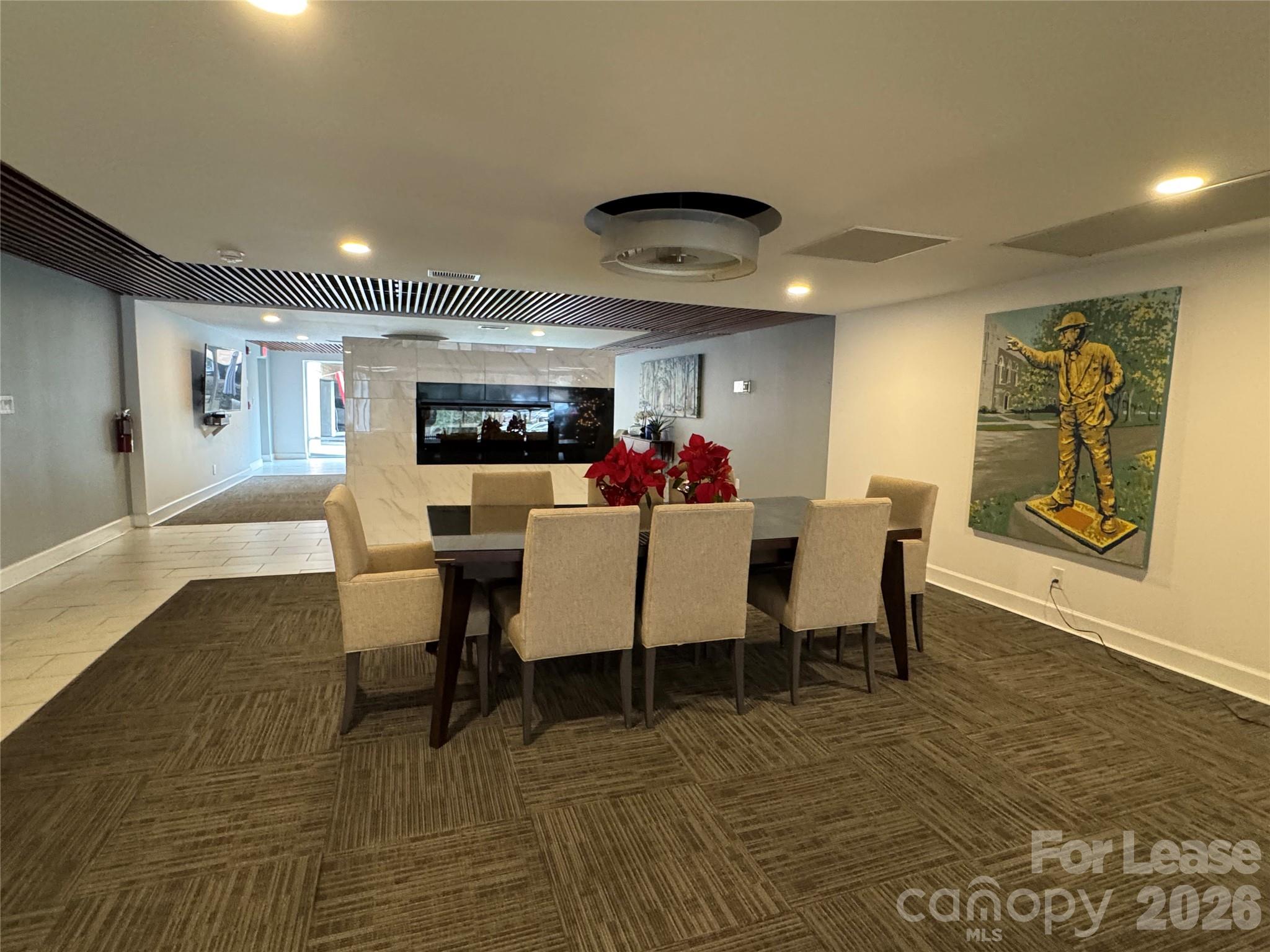 1323 Queens Road, Unit 303 Charlotte, NC 28207 - Photo 27 of 47 a view of a dining room with furniture