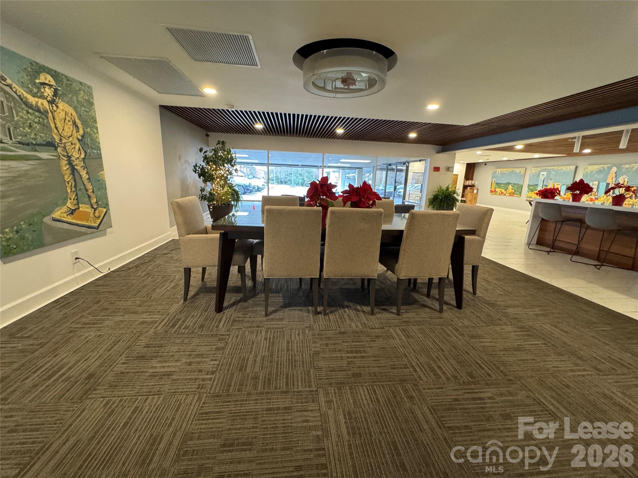 1323 Queens Road, Unit 303 Charlotte, NC 28207 - Photo 32 of 47 a view of a dining room with furniture