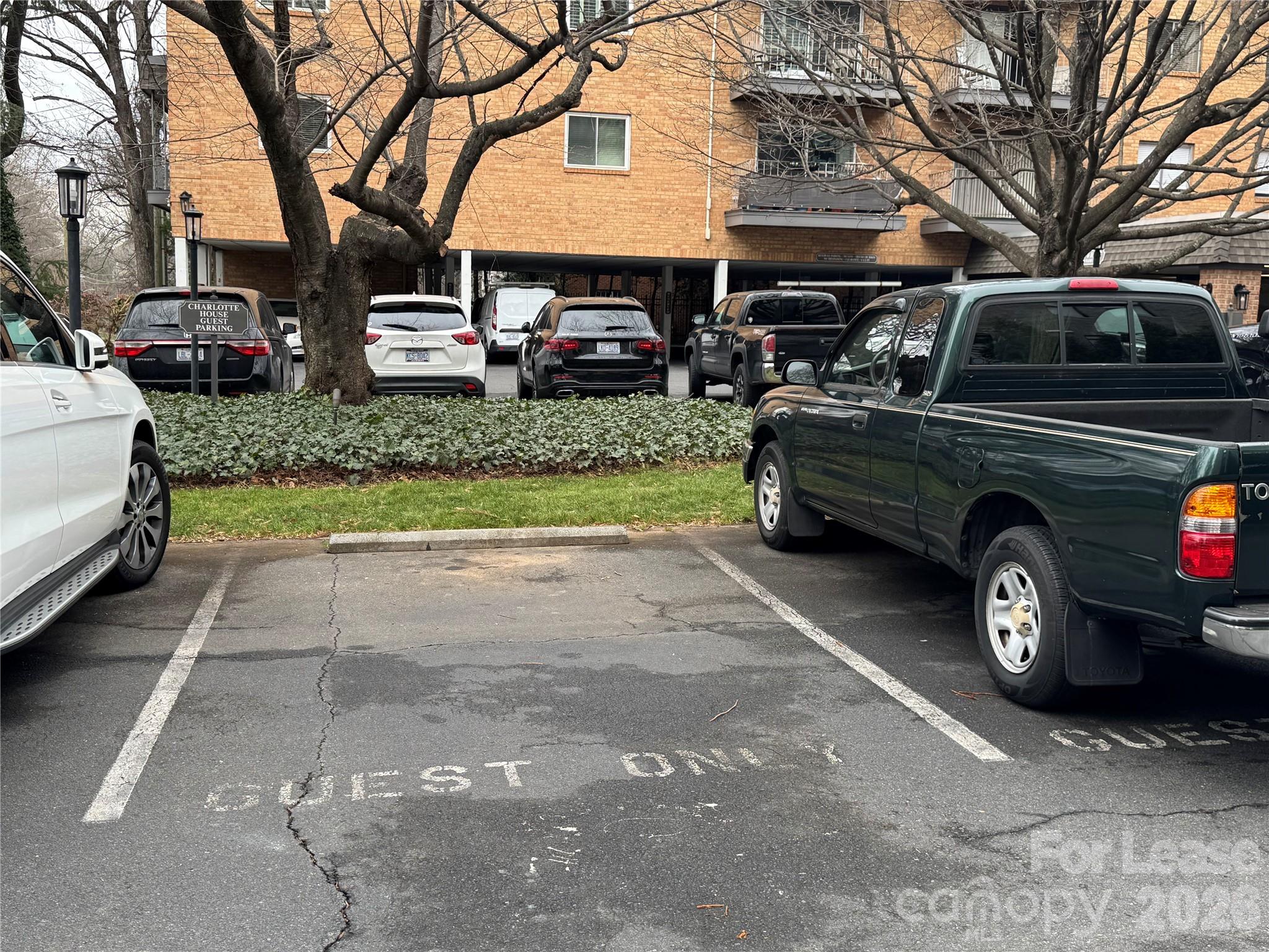 1323 Queens Road, Unit 303 Charlotte, NC 28207 - Photo 35 of 47 a car parked in front of a house