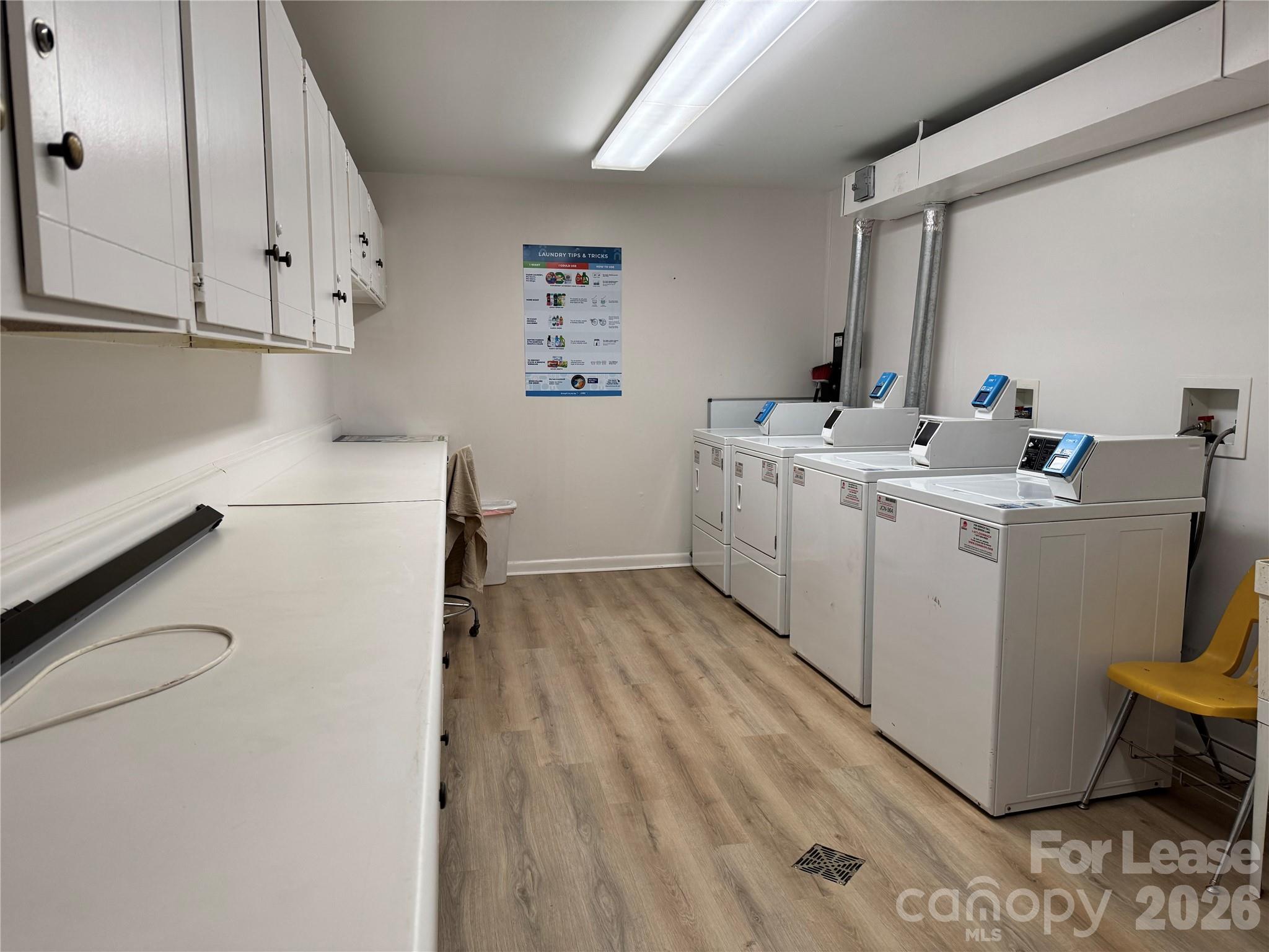 1323 Queens Road, Unit 303 Charlotte, NC 28207 - Photo 37 of 47 a utility room with dryer and washer