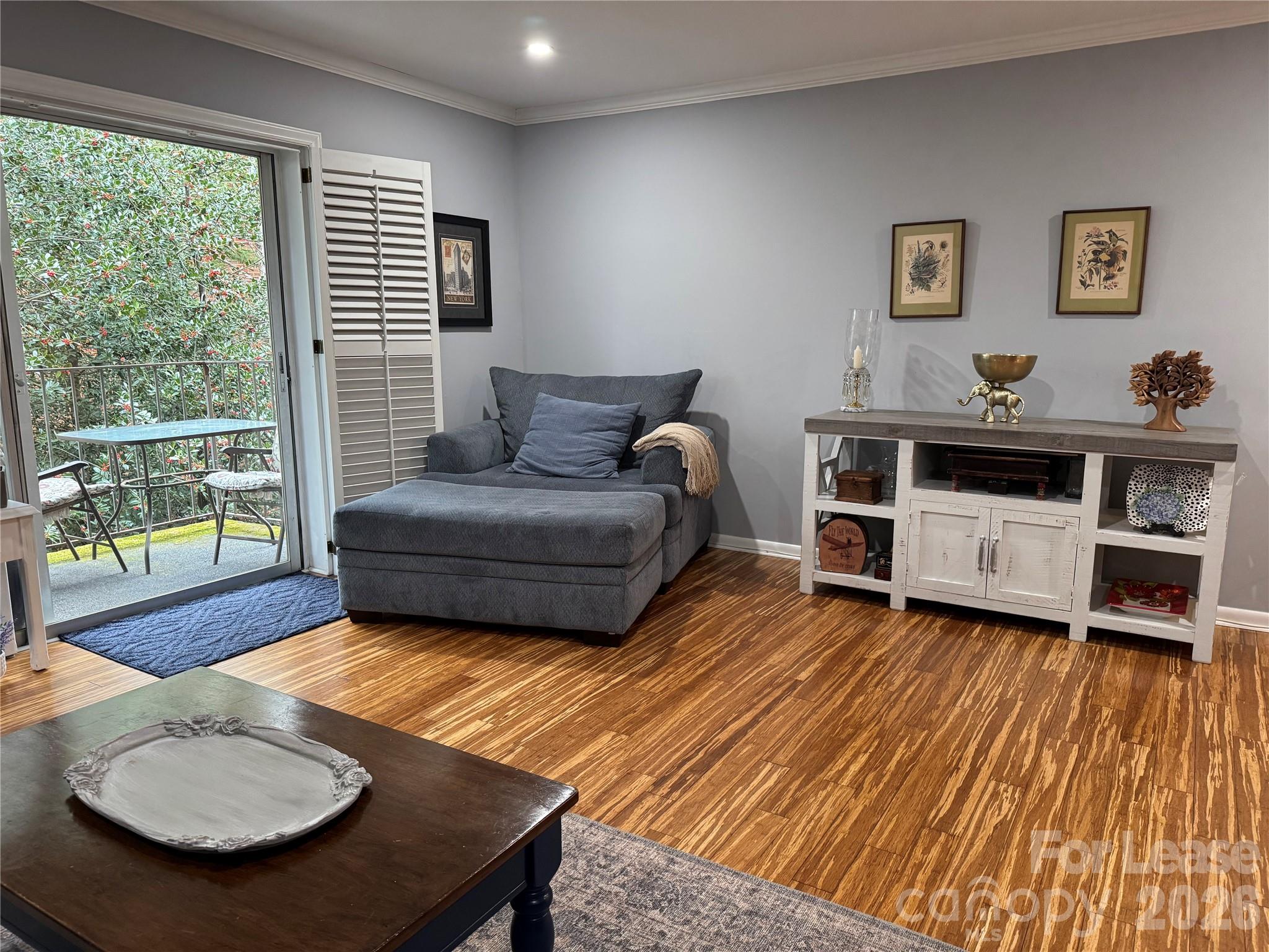 1323 Queens Road, Unit 303 Charlotte, NC 28207 - Photo 5 of 47 a living room with furniture and a wooden floor