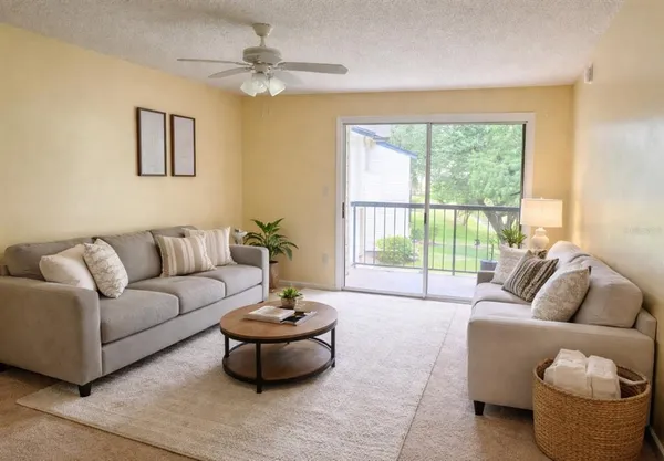 a living room with furniture and a large window