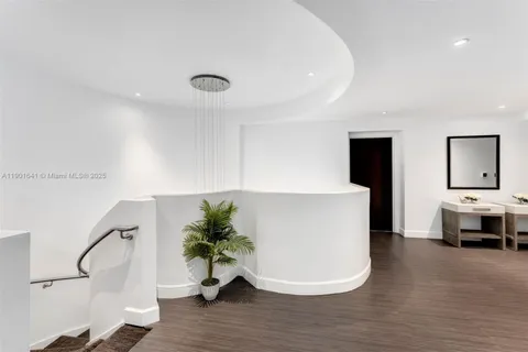 a bedroom with a large bed and a couch