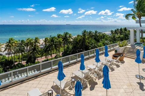 a bedroom with a large bed and a large window