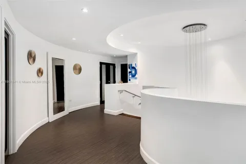 a view of a balcony with potted plants