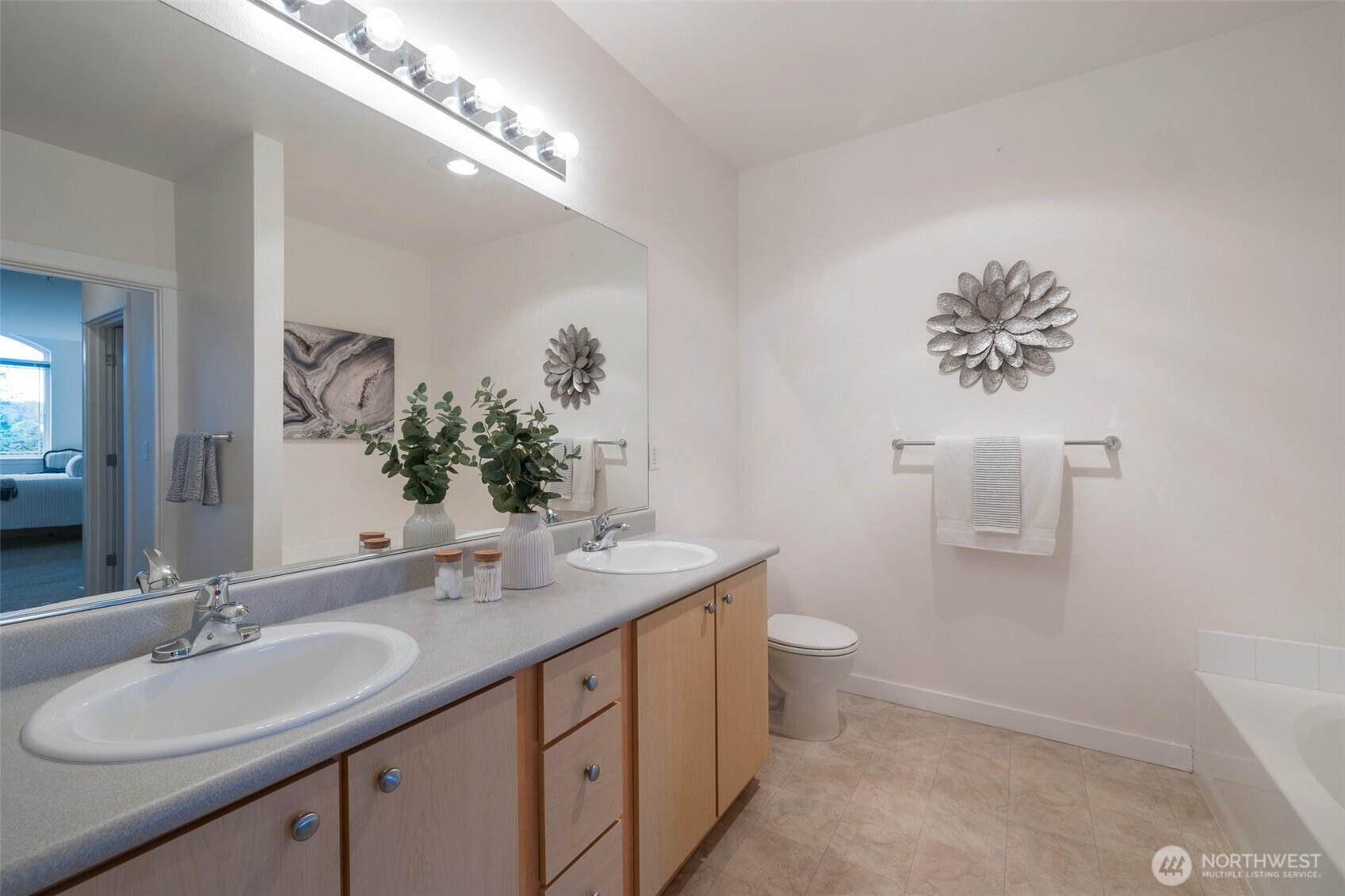 13301 Southeast 79th Place, Unit B402 Newcastle, WA 98059 - Photo 15 of 25 a bathroom with a double vanity sink and a mirror