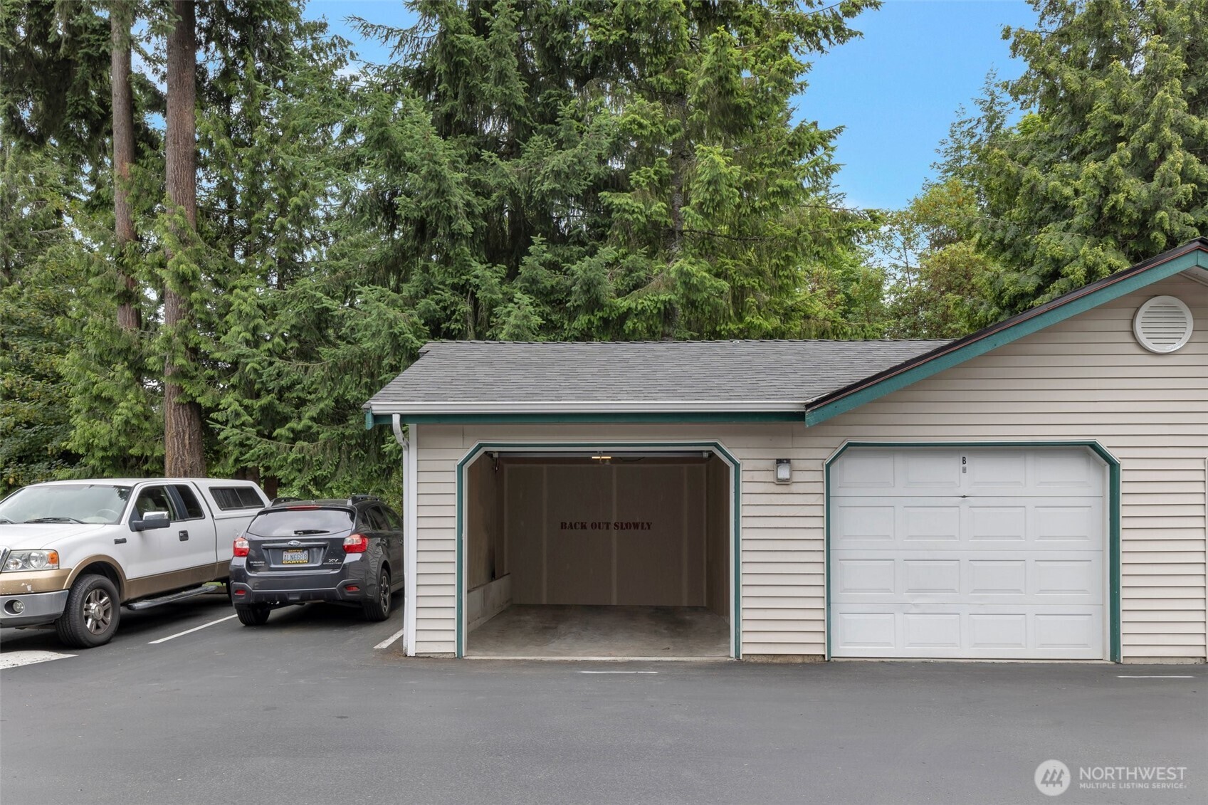 13301 Southeast 79th Place, Unit B402 Newcastle, WA 98059 - Photo 19 of 25 a view of a car parked in front of a house