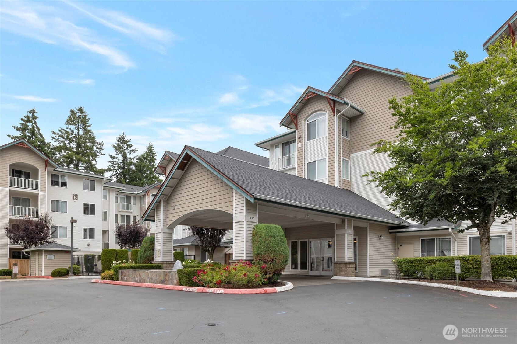 13301 Southeast 79th Place, Unit B402 Newcastle, WA 98059 - Photo 2 of 25 a house view with a outdoor space