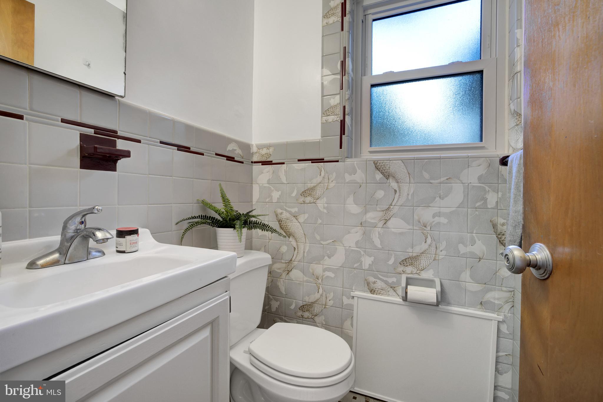 9801 Old Spring Road Kensington, MD 20895 - Photo 18 of 38 main level half bath off the den/guest room